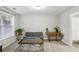 Cozy basement with a comfortable sofa, coffee table, and natural light at 7275 Highland Blf # 8, Atlanta, GA 30328