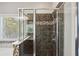 Modern bathroom with a glass-enclosed shower featuring sleek fixtures and tile details at 7275 Highland Blf # 8, Atlanta, GA 30328