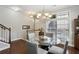 Cozy dining room with a round glass table, stylish chairs, and natural light from a large window at 7275 Highland Blf # 8, Atlanta, GA 30328