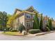Beautiful exterior of a townhome featuring manicured greenery and a view of the surrounding landscape at 7275 Highland Blf # 8, Atlanta, GA 30328