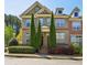 Charming townhome with well-manicured landscaping and a welcoming facade on a clear, sunny day at 7275 Highland Blf # 8, Atlanta, GA 30328