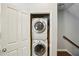 Convenient laundry area features stacked washer and dryer units inside closet, with added storage at 7275 Highland Blf # 8, Atlanta, GA 30328