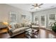 Bright living room with comfortable seating, a ceiling fan, and large windows providing ample natural light at 7275 Highland Blf # 8, Atlanta, GA 30328