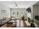 Cozy living room featuring a fireplace, comfortable seating, and access to the outdoors through glass doors at 7275 Highland Blf # 8, Atlanta, GA 30328
