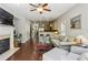 Inviting living room features hardwood floors, stylish furniture, and a cozy fireplace at 7275 Highland Blf # 8, Atlanta, GA 30328