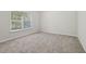 Carpeted bedroom offering a bright and airy feel with lots of natural light and neutral walls at 1025 Pebble Creek Trl, Suwanee, GA 30024