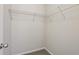 Walk-in closet featuring ample storage space with custom shelving for organization at 1025 Pebble Creek Trl, Suwanee, GA 30024