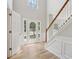 Welcoming foyer with hardwood floors, staircase, and plenty of natural light at 1025 Pebble Creek Trl, Suwanee, GA 30024