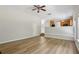 Spacious living room open to the kitchen, featuring wood-look floors and neutral paint at 1025 Pebble Creek Trl, Suwanee, GA 30024