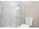 Updated bathroom featuring a walk-in shower, toilet, and modern finishes at 1181 Mannbrook Dr, Stone Mountain, GA 30083