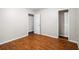 Bedroom featuring a doorway, wood flooring and light-colored walls at 1181 Mannbrook Dr, Stone Mountain, GA 30083