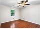 Cozy bedroom with wood flooring and a window, providing a comfortable and bright space at 1181 Mannbrook Dr, Stone Mountain, GA 30083