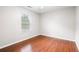 Bright bedroom featuring wood flooring, a window and natural light at 1181 Mannbrook Dr, Stone Mountain, GA 30083