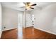 Comfortable bedroom featuring wood floors and doorways to a bathroom and another room at 1181 Mannbrook Dr, Stone Mountain, GA 30083