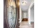 Inviting entryway showcasing a decorative glass front door, leading into a home with light-colored walls and flooring at 1181 Mannbrook Dr, Stone Mountain, GA 30083