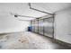 Spacious garage with a roll-up door and concrete floors at 1181 Mannbrook Dr, Stone Mountain, GA 30083