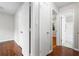 Hallway with multiple doors leading to rooms and a bathroom at 1181 Mannbrook Dr, Stone Mountain, GA 30083