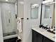 Modern bathroom featuring a sleek vanity and a tiled glass-enclosed shower at 2706 Cedar Dr, Lawrenceville, GA 30043