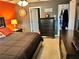 Cozy bedroom design with dark furniture and complementary wall colors at 2706 Cedar Dr, Lawrenceville, GA 30043