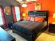 Stylish bedroom with a padded headboard, complementary wall color and bright natural light at 2706 Cedar Dr, Lawrenceville, GA 30043