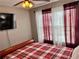 Bedroom featuring a comfortable bed, bright window and modern TV at 2706 Cedar Dr, Lawrenceville, GA 30043