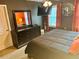 Well-lit bedroom featuring a dark wood dresser and a large mirror at 2706 Cedar Dr, Lawrenceville, GA 30043