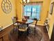 Quaint dining area featuring a round table and inviting window nook at 2706 Cedar Dr, Lawrenceville, GA 30043