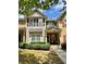 Charming townhome featuring low-maintenance landscaping and a welcoming covered entryway at 2706 Cedar Dr, Lawrenceville, GA 30043