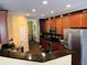 Well-equipped kitchen boasting stainless steel appliances and sleek dark granite countertops at 2706 Cedar Dr, Lawrenceville, GA 30043