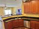 Modern kitchen featuring stainless steel appliances, and a seamless view to the living area at 2706 Cedar Dr, Lawrenceville, GA 30043