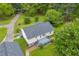Aerial view of home with a spacious backyard and mature trees at 3100 Meadow Trl, Loganville, GA 30052
