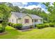Charming home with a cozy front porch, red shutters, and beautifully landscaped yard, creating inviting curb appeal at 3100 Meadow Trl, Loganville, GA 30052