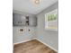 Convenient laundry room with overhead cabinets and ample space, designed for practicality and organization at 3100 Meadow Trl, Loganville, GA 30052