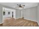 Living Room with wood flooring, white walls, and open to kitchen area at 3100 Meadow Trl, Loganville, GA 30052