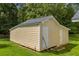 Versatile outbuilding with dual access doors, perfect for storage or workshop space, surrounded by green lawn at 3100 Meadow Trl, Loganville, GA 30052