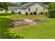 Lush yard featuring a well-maintained garden with raised beds, complemented by the home's exterior in the background at 3100 Meadow Trl, Loganville, GA 30052
