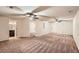 Finished basement with carpet, ceiling fans and access to bathroom at 3280 Hallmark Ln, Buford, GA 30519