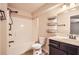 Neutral bathroom featuring a shower-tub combo, black fixtures and wall mounted shelving at 3280 Hallmark Ln, Buford, GA 30519