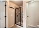 Tiled shower with glass door and chrome hardware at 3280 Hallmark Ln, Buford, GA 30519