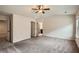 Large bedroom features neutral carpet, ceiling fan, and dual doors at 3280 Hallmark Ln, Buford, GA 30519