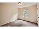 Cozy bedroom with a single window, carpeted floor, and neutral walls at 3280 Hallmark Ln, Buford, GA 30519