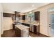 Well-equipped kitchen with granite countertops, stainless appliances, and a breakfast bar at 3280 Hallmark Ln, Buford, GA 30519