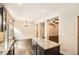Open kitchen with granite island, stainless steel appliances, and hardwood floors at 3280 Hallmark Ln, Buford, GA 30519