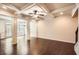 Open living area boasts hardwood floors, coffered ceilings, and natural light at 3280 Hallmark Ln, Buford, GA 30519