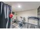 Basement features some exercise equipment, a dark curtain, and wallpaper at 5609 Twin Oak Dr, Douglasville, GA 30135