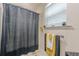 Bathroom with shower and gray curtain at 5609 Twin Oak Dr, Douglasville, GA 30135