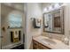 Bathroom features mirror, vanity, and natural lighting at 5609 Twin Oak Dr, Douglasville, GA 30135