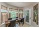 Bright breakfast nook with a dining table, windows with valances, and a view of the outdoors at 5609 Twin Oak Dr, Douglasville, GA 30135