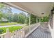 Relaxing front porch features rocking chairs and a view of the landscaped front yard at 5609 Twin Oak Dr, Douglasville, GA 30135