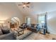 Comfortable living room with vaulted ceiling, hardwood floors, and a cozy seating area bathed in natural light at 5609 Twin Oak Dr, Douglasville, GA 30135